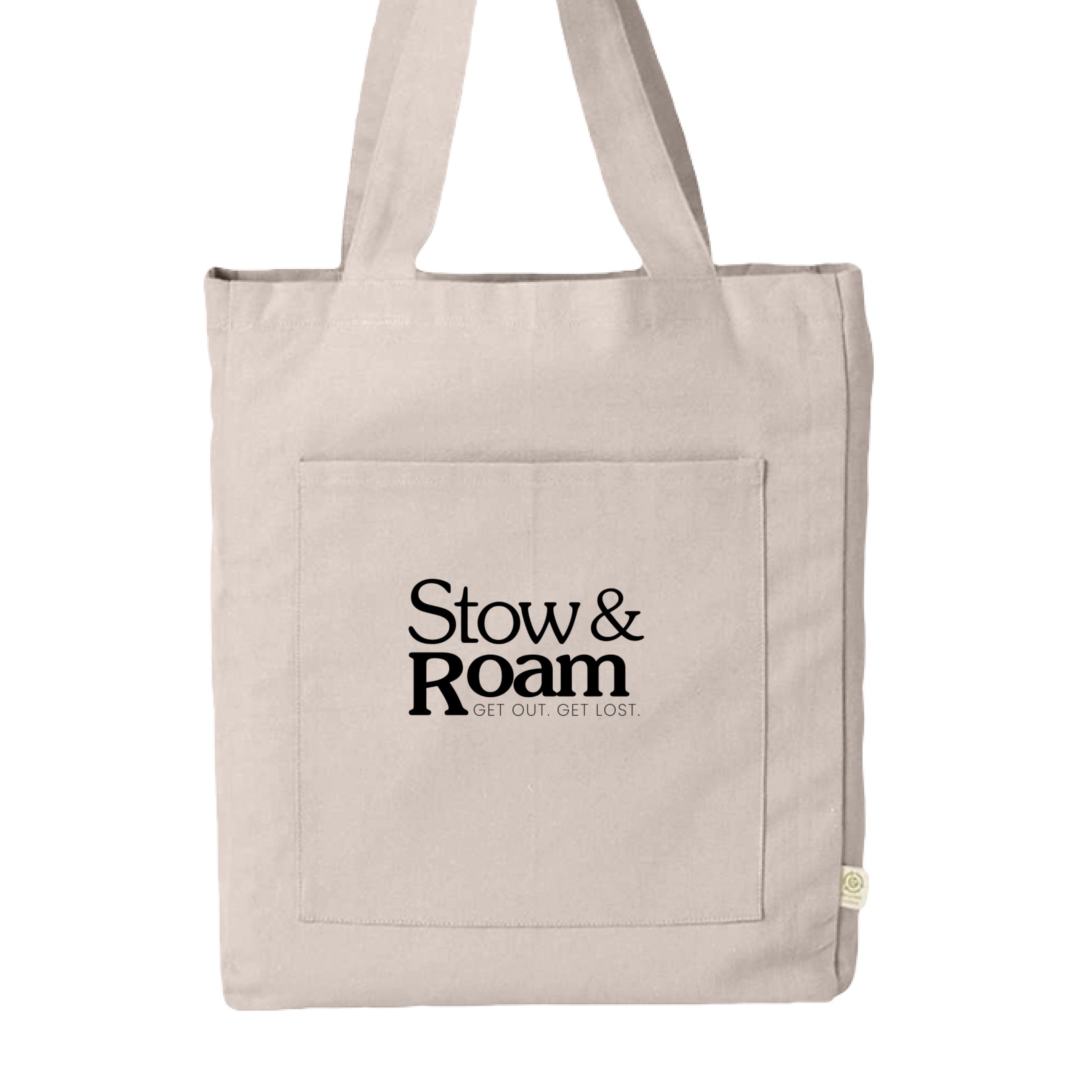 Beige tote bag with 'Stow & Roam' text on a white background